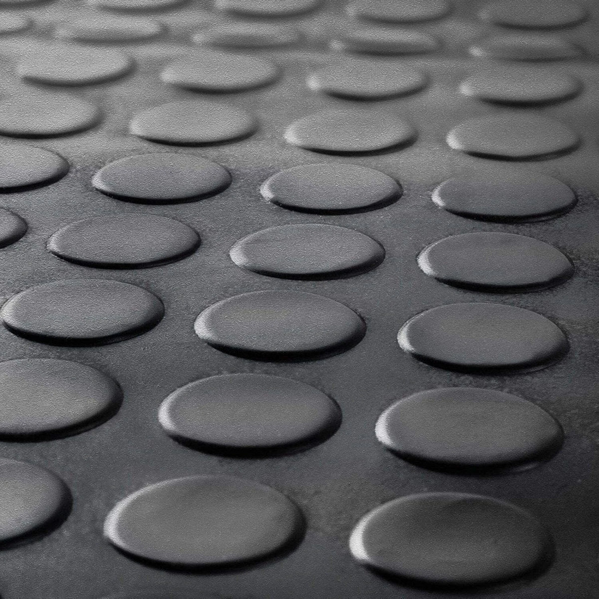 Close-up of black coin rubber flooring tread