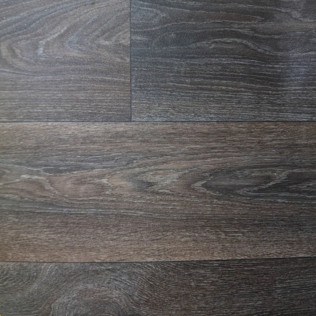 Dark brown wood-effect vinyl flooring showing the plank pattern