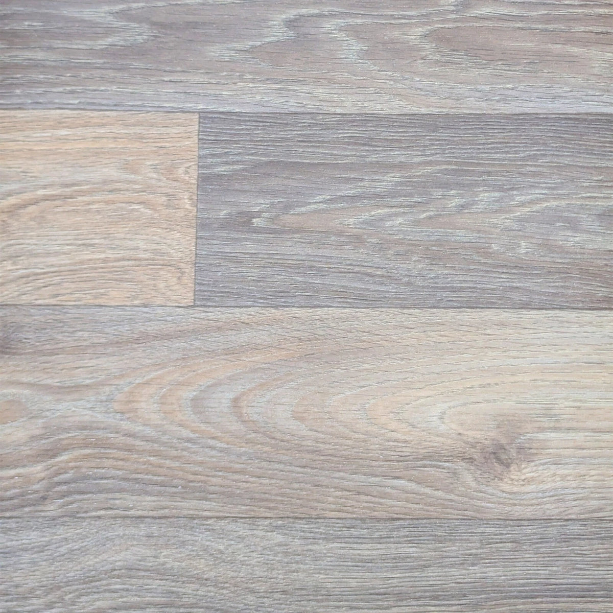 Grey and brown wood-effect vinyl flooring showing the plank pattern
