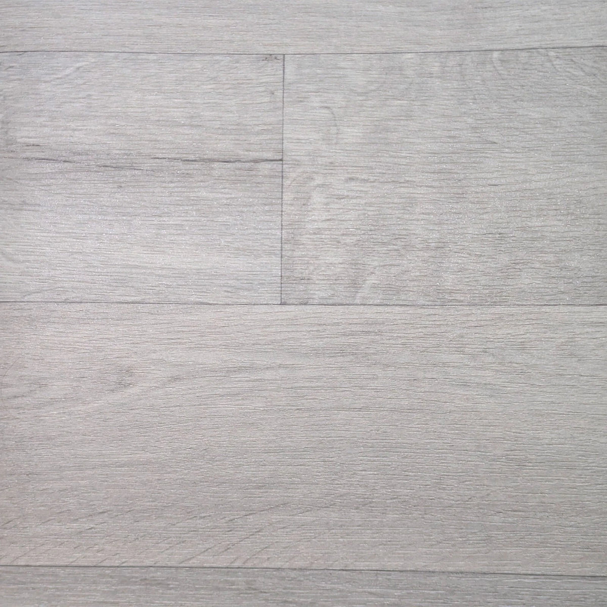 Pale grey wood-effect vinyl flooring showing the grain and plank pattern