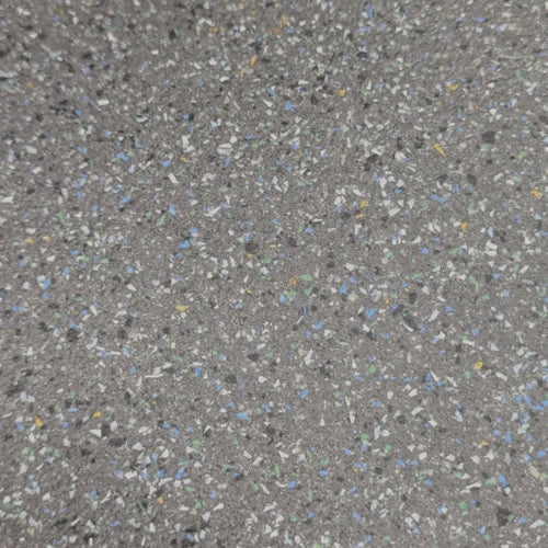 Dark grey speckled vinyl texture close-up